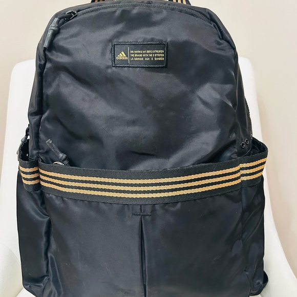 adidas Handbags - adidas Black Backpack with Gold Stripe Webbing